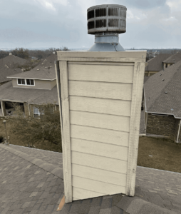 A close-up of chimney with cap and crown on the roof of a home in Austin, TX.
